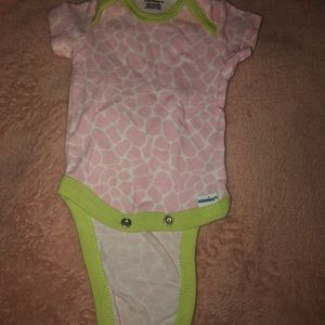 Green pink and white giraffe print onesie